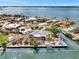 An aerial view with property outline, revealing a waterfront home on canals with boat access at 232 Bahia Vista Dr, Englewood, FL 34223