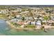 Waterfront neighborhood with mature trees surrounding a large pond, highlighting its serene and desirable location at 232 Bahia Vista Dr, Englewood, FL 34223
