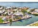 Waterfront home with a screened lanai, seawall, dock and mature tropical landscaping at 232 Bahia Vista Dr, Englewood, FL 34223
