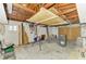 Spacious unfinished basement with exposed wooden beams, ideal for customizing to your needs at 232 Bahia Vista Dr, Englewood, FL 34223