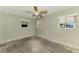 Bedroom with two windows and a ceiling fan at 232 Bahia Vista Dr, Englewood, FL 34223