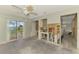 Bright living room with access to the patio and backyard at 232 Bahia Vista Dr, Englewood, FL 34223