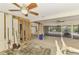 Spacious room awaiting renovation with ceiling fans, access to outdoor patio and bright, airy feel at 232 Bahia Vista Dr, Englewood, FL 34223