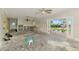 Living room under renovation with an open floor plan, ceiling fan and sliding glass doors to the outdoors at 232 Bahia Vista Dr, Englewood, FL 34223