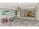 Covered patio featuring brick flooring, string lights, ceiling fan and view to the renovation in progress at 232 Bahia Vista Dr, Englewood, FL 34223