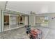 Covered patio with brick flooring and string lights, offering a view to the renovation in progress at 232 Bahia Vista Dr, Englewood, FL 34223