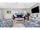Comfortable living room offering a cozy atmosphere and plenty of natural light, great for relaxation and entertaining at 2375 N Beach Rd # 2B, Englewood, FL 34223