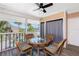 Inviting screened-in patio with wicker furniture and views of the beautiful pool area at 2375 N Beach Rd # 2B, Englewood, FL 34223