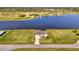 Scenic aerial view of a home situated on a waterfront property surrounded by lush landscapes at 43 Blue Hen Dr, Placida, FL 33946