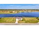 Aerial view of a home situated on a waterfront property surrounded by lush landscapes at 43 Blue Hen Dr, Placida, FL 33946