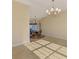 Bright dining room features tiled floors, a chandelier, and views of the water and pool at 43 Blue Hen Dr, Placida, FL 33946