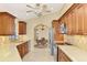 Bright kitchen featuring stainless steel appliances, wooden cabinets, and tile backsplash at 43 Blue Hen Dr, Placida, FL 33946