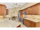 Well-lit kitchen featuring stainless appliances, ample counter space, and wooden cabinetry at 43 Blue Hen Dr, Placida, FL 33946