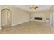 Spacious living room featuring neutral tile flooring, a ceiling fan, and a modern fireplace at 43 Blue Hen Dr, Placida, FL 33946