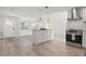 Bright, open-concept living space with modern appliances, kitchen island, and an inviting atmosphere at 84 Caddy Rd, Rotonda West, FL 33947