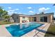 Enjoy a private swimming pool with a seating area, perfect for relaxing outdoors at 84 Caddy Rd, Rotonda West, FL 33947