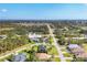 Residential area with single-Gathering homes, mature trees, and quiet streets viewed from above at 100 Hobo Rd, Rotonda West, FL 33947