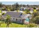Aerial view of home featuring backyard pool and tropical landscaping at 100 Hobo Rd, Rotonda West, FL 33947