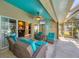 Enjoy the comfort of this covered patio with views to the pool and living room at 100 Hobo Rd, Rotonda West, FL 33947