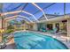 Enjoy the pristine pool with screened lanai and home exterior at 100 Hobo Rd, Rotonda West, FL 33947