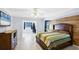Spacious bedroom boasts stylish accent walls, tile floors, and a private home office at 1087 Bay Harbor Dr, Englewood, FL 34224