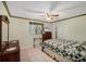 Cozy bedroom with traditional furnishings and a neutral color palette at 1087 Bay Harbor Dr, Englewood, FL 34224