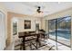 Dining room with a view of the pool through sliding glass doors at 1087 Bay Harbor Dr, Englewood, FL 34224