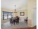 Dining room features a chandelier and lots of natural light from the bay window at 1087 Bay Harbor Dr, Englewood, FL 34224