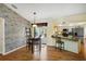 Charming kitchen features wood floors, updated appliances, and a breakfast bar overlooking the dining area at 1087 Bay Harbor Dr, Englewood, FL 34224