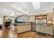 Bright open kitchen featuring a vaulted ceiling, lots of natural light, and modern finishes at 1087 Bay Harbor Dr, Englewood, FL 34224