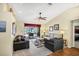 Spacious living area featuring views to the lanai, neutral paint, and an open floorplan at 1087 Bay Harbor Dr, Englewood, FL 34224