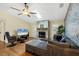 Bright living room with a vaulted ceiling, stone fireplace, and comfortable sectional sofa at 1087 Bay Harbor Dr, Englewood, FL 34224