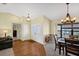 Inviting living room boasts hardwood floors, decorative wheel, and comfortable furnishings at 1087 Bay Harbor Dr, Englewood, FL 34224