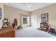Bedroom with a closet, desk, and bright window view at 13354 Blytheville Ave, Port Charlotte, FL 33981