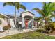 Charming home featuring a welcoming front entrance and beautifully landscaped yard at 13354 Blytheville Ave, Port Charlotte, FL 33981