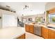 Kitchen with island, stainless appliances and open to the living area at 13354 Blytheville Ave, Port Charlotte, FL 33981
