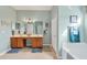 Well-lit main bathroom with a double vanity, bathtub, and neutral tones at 13354 Blytheville Ave, Port Charlotte, FL 33981
