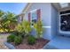 Tasteful landscaping framing the entrance to a single Gathering home at 15081 Aldama Cir, Port Charlotte, FL 33981