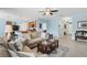 Cozy living room featuring tile floors, an open floor plan and eat-in kitchen at 15081 Aldama Cir, Port Charlotte, FL 33981