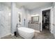Elegant bathroom featuring freestanding tub, marble shower, and sophisticated vanity with great storage at 15691 Meacham Cir, Port Charlotte, FL 33981