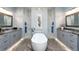 Stunning bathroom with dual vanities, freestanding tub, and luxurious marble accents, perfect for relaxation at 15691 Meacham Cir, Port Charlotte, FL 33981