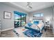 Bedroom with a pool view from the sliding glass doors with black trim at 15691 Meacham Cir, Port Charlotte, FL 33981
