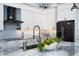 Gourmet kitchen with stainless steel appliances, granite countertops, and custom cabinets at 15691 Meacham Cir, Port Charlotte, FL 33981