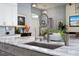 Kitchen with marble countertops, modern faucet, and eat-in breakfast bar area at 15691 Meacham Cir, Port Charlotte, FL 33981