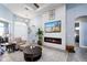 Comfortable living room featuring a modern fireplace and stylish decor elements at 15691 Meacham Cir, Port Charlotte, FL 33981