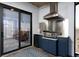 Covered outdoor kitchen area with stainless steel appliances and granite countertops at 15691 Meacham Cir, Port Charlotte, FL 33981