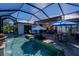 Relaxing screened-in pool area with outdoor seating and dining space at 15691 Meacham Cir, Port Charlotte, FL 33981
