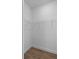 Walk-in closet features wood-look flooring and wire shelving at 1664 Jagust Rd, North Port, FL 34288