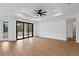 Open-concept living room featuring recessed lighting, ceiling fan, and sliding glass doors to the outdoors at 1664 Jagust Rd, North Port, FL 34288