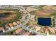 Aerial view of the neighborhood with numerous homes and lakes at 209 Malina Ct, Nokomis, FL 34275